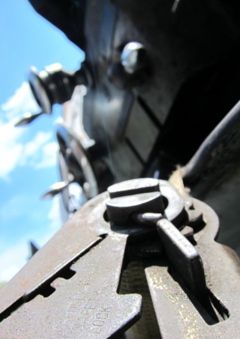 Juxtaposition - dirty lathe under a blue sky - photo - Rob Vandemark