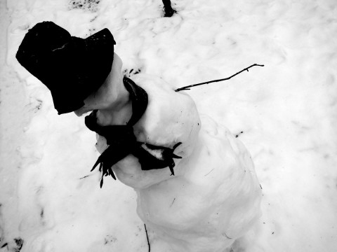 Snowman pointing the way